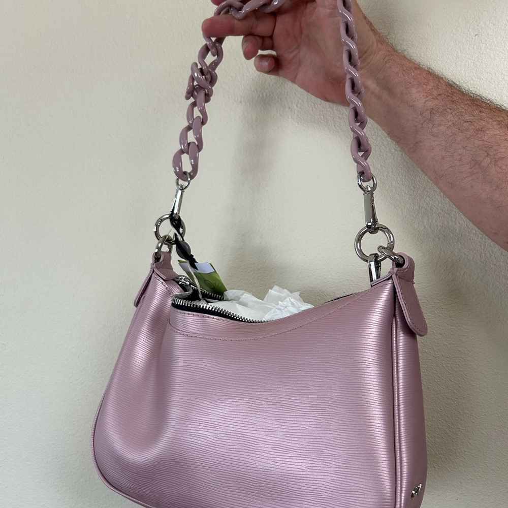 Shoulder bag. New with tags. Unlined. Recycled PVC. Color light purple.